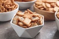 Delicious crackers in bowls on grey table, closeup Royalty Free Stock Photo