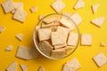 Delicious crackers on yellow background, flat lay Royalty Free Stock Photo