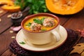 Delicious cream of pumpkin soup with meatballs made of turkey minced meat