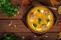 Delicious cream of pumpkin soup with meatballs made of turkey minced meat Royalty Free Stock Photo