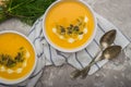 Delicious creamy homemade pumpkin soup with cream and pumpkin se