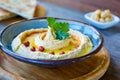 A delicious, creamy hummus garnished with spices and herbs, ready to be served Royalty Free Stock Photo