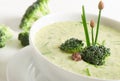 Delicious creamy vegetable soup in a white bowl.