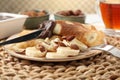 Delicious crepes with banana, nuts and chocolate paste on table, closeup Royalty Free Stock Photo