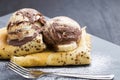 Delicious crepes filled with chocolate sauce, with ice cream scoops on top, elegant tasty dessert dish serving Royalty Free Stock Photo