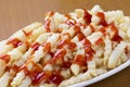 Delicious crinkle cut style french fries with ketchup Royalty Free Stock Photo