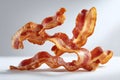 Crispy bacon strips displayed creatively on a white background showcasing their texture and flavor Royalty Free Stock Photo