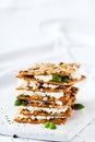 Delicious crispy crackers with cheese and basil