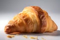 Delicious, crispy croissant on a light background. The croissant is carefully arranged to highlight its flaky layers.