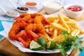 Delicious crispy crunchy parmesan bread crumbs coating Fried Shrimps with lime wedges, french fries and parsley Royalty Free Stock Photo