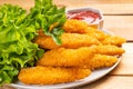 Delicious crispy fried breaded chicken breast strips.Delicious crispy chicken fillet in bread crumbs with ketchup close-up on a Royalty Free Stock Photo