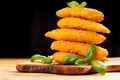 Delicious crispy fried breaded chicken breast strips on black background close up Royalty Free Stock Photo
