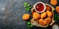 Delicious crispy fried breaded nuggets with ketchup on black plate. Dark background Royalty Free Stock Photo