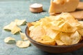 Delicious crispy potato chips in bowl on table, closeup Royalty Free Stock Photo