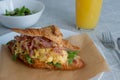 Delicious croissant with bacon scrambled egg