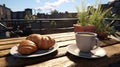 Delicious croissant and cup of coffee on an urban outdoor coffee table in a scenic setting