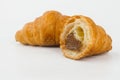 Delicious croissants with cherry jam on a white background