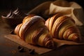 Delicious croissants with chocolate on wooden table, selective focus