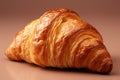 Delicious croissants placed on the right side of the frame with a sandy beige backdrop