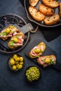 Delicious crostini with avocado spread and serrano or prosciutto ham Royalty Free Stock Photo