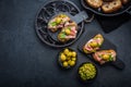 Delicious crostini with avocado spread and serrano or prosciutto ham Royalty Free Stock Photo