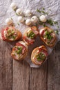 Delicious crostini with bacon and mozzarella cheese. vertical to Royalty Free Stock Photo