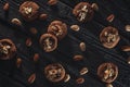 Delicious and crunchy cookies with almond and chocolate on dark wooden background