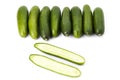 Delicious cucumbers, one cut in half. Tasty vegetables