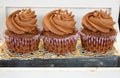 Delicious cup cakes with chocolate cream