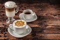 Delicious Cup of hot cappucino is on the wooden table. It is an art on the latte Royalty Free Stock Photo