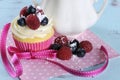 Delicious cupcake with berries