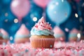 Delicious cupcake decorated with blue and pink frosting and colorful sprinkles. Dessert served at gender reveal or a baby shower