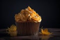 Delicious cupcake with orange frosting. decorative homemade halloween white and orange frosted cupcakes with eyes on