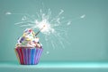 Delicious cupcake with a sparkler for an event celebration.