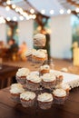 Delicious cupcakes on candy buffet. Modern weding. Candy bar. Royalty Free Stock Photo