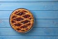 Delicious currant pie and fresh berries on blue wooden table, top view. Space for text Royalty Free Stock Photo