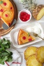 Delicious cut pineapple pie served with ice cream on white wooden table, flat lay Royalty Free Stock Photo