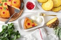 Delicious cut pineapple pie served with ice cream on white wooden table, flat lay Royalty Free Stock Photo