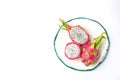 Delicious cut and whole dragon fruits pitahaya on background, top view