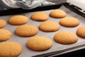 Delicious Danish butter cookies on baking tray, closeup