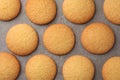 Delicious Danish butter cookies on baking tray, flat lay