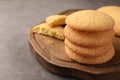 Delicious Danish butter cookies on grey table, closeup