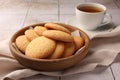 Delicious Danish butter cookies and tea on white tiled table, closeup Royalty Free Stock Photo