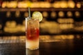 Delicious Dark Stormy cocktail decorated with lime slice on the bar counter