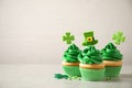 Delicious decorated cupcakes on table, space for text. St. Patrick`s Day celebration