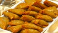 Delicious Deep fried south Indian Samosa pies on a white tray,-21 JULY 2017