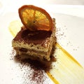 a delicious desert - Close up of Tiramisu with a roasted orange slice Royalty Free Stock Photo