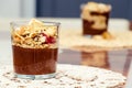 Delicious dessert with banana and biscuits chocolate pudding in glass cup on table Royalty Free Stock Photo