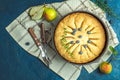 Delicious dessert blueberry tart with fresh berries and pears, sweet tasty cheesecake, berry pie on dark blue concrete surface Royalty Free Stock Photo