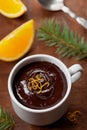 Delicious dessert from dark chocolate mousse with orange slice decorated citrus peel Royalty Free Stock Photo